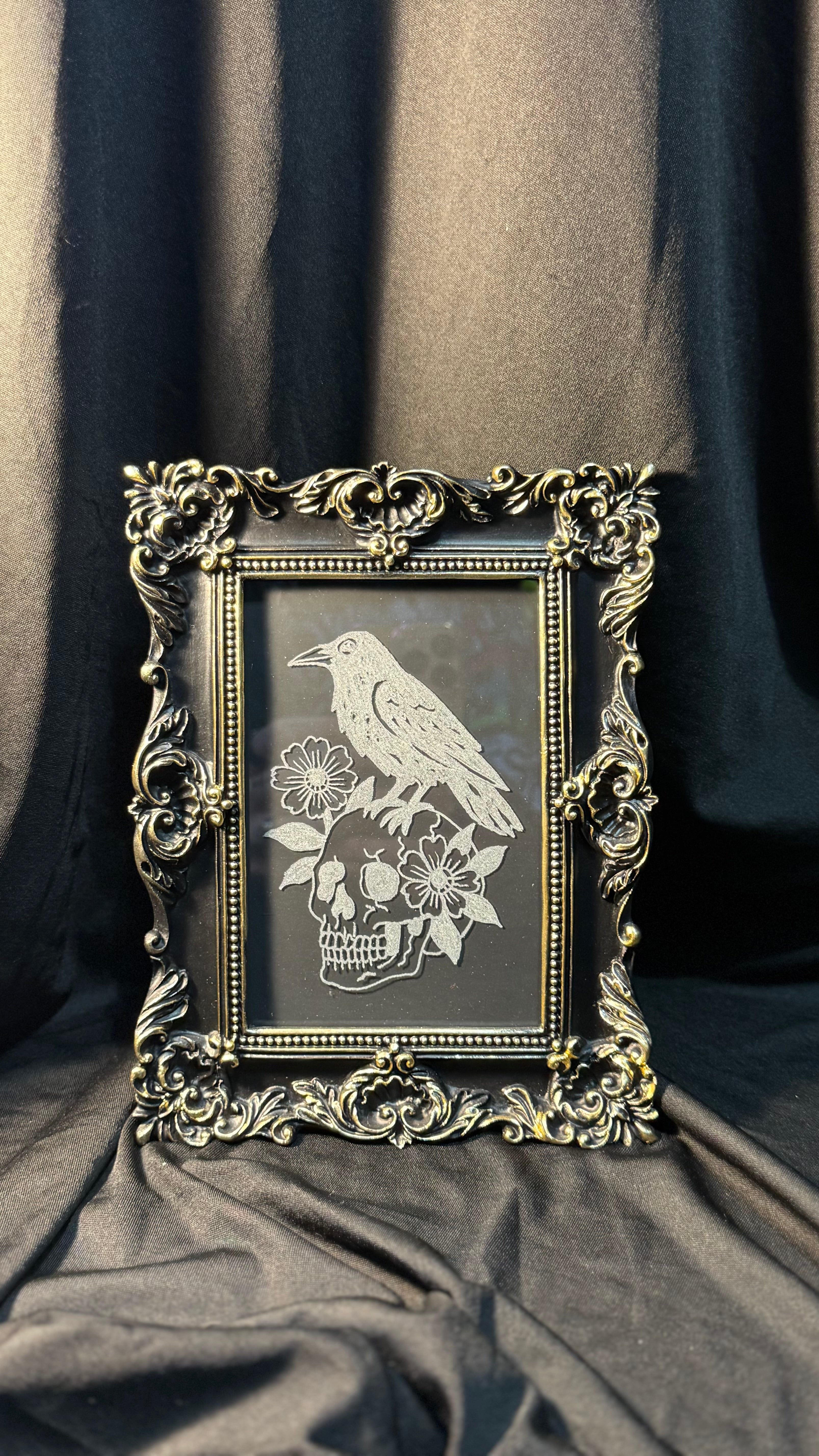 Raven and skull engraving