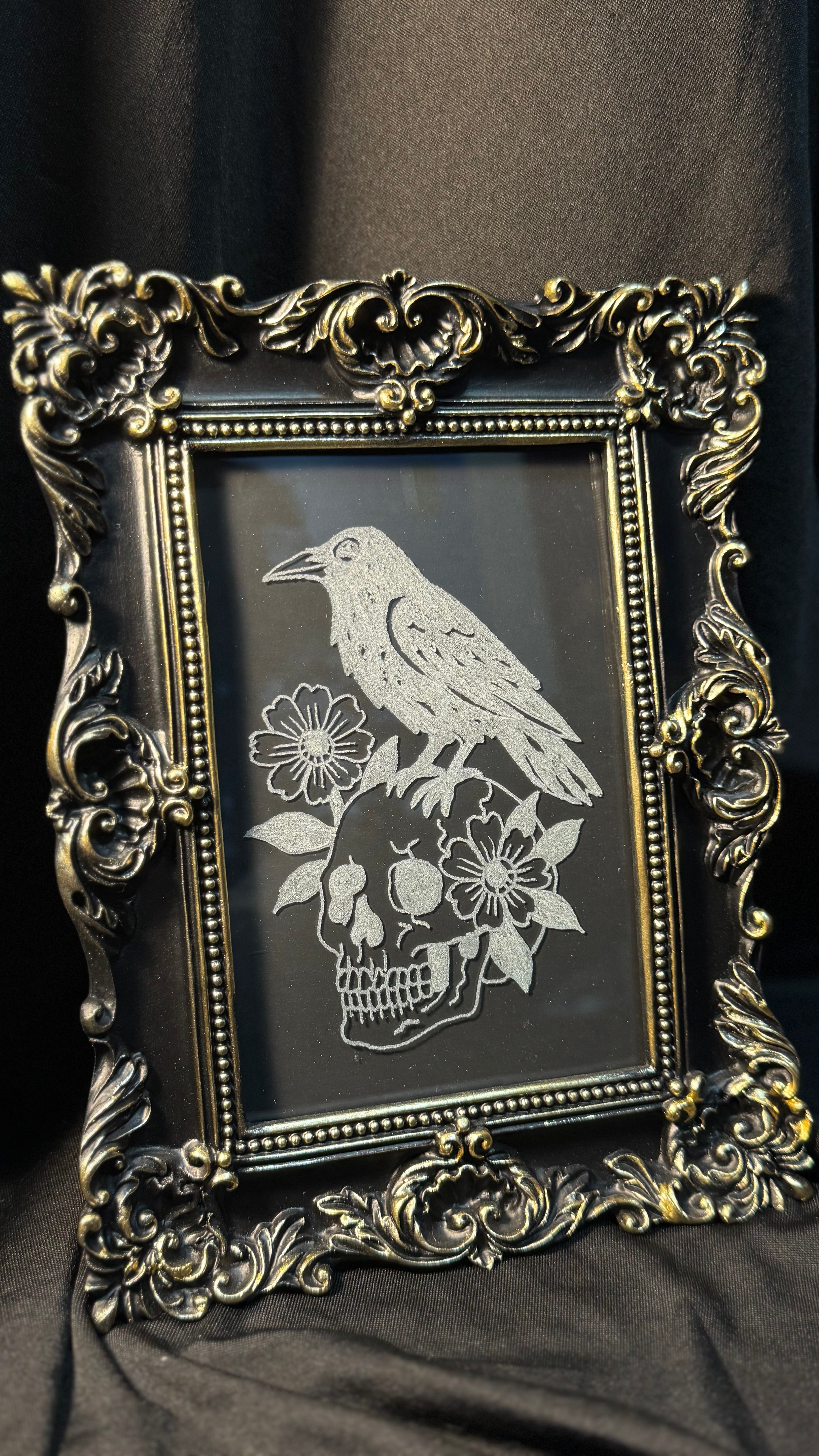 Raven and skull engraving